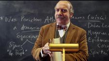 Mr. Hunham (Paul Giamatti) teaching class in the cognac-colored corduroy suit
