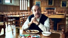 Paul Hunham (Paul Giamatti) with Christmas cookies brought to him by Miss Crane (Carrie Preston)