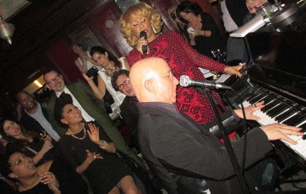 Paul Shaffer accompanying Darlene Love in "Christmas (Baby Please Come Home)" as the holiday revelers join in.