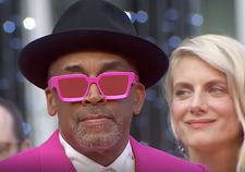 Jury President Spike Lee looking pretty cool in pink at last night’s Cannes Film Festival red carpet premiere, flanked by jury member Mélanie Laurent