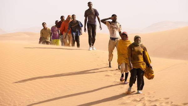 Seydou (Seydou Sarr) with Moussa (Moustapha Fall) crossing the desert