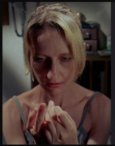 Nicole (Suzanne Fletcher) pricks her finger
