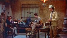 Walter Brennan, Dean Martin, Ricky Nelson, and John Wayne enjoying My Rifle, My Pony, and Me in Rio Bravo