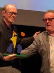 Steve Buscemi recieves his award from Colm Meaney