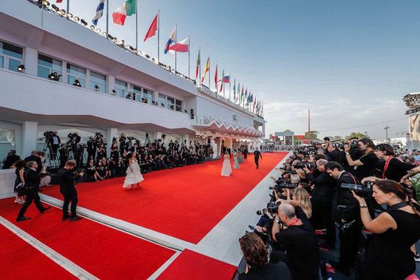 Walking the red carpet in Venice last year: Film festival organisers plan to go ahead with the event.