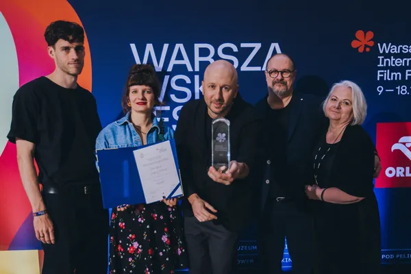 Grzegorz Dębowski, centre, and the What Belongs To Others team